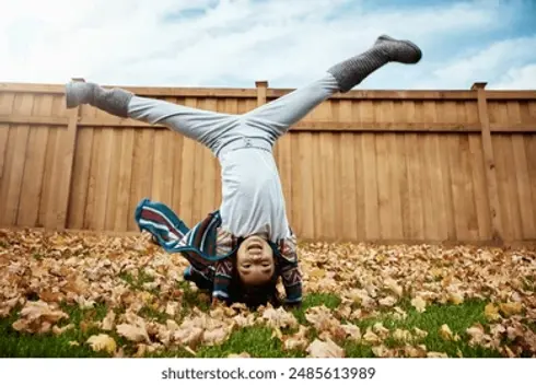 child-playing-cartwheels-outdoor-autumn-260nw-2485613989.jpg