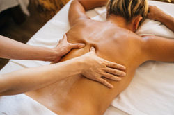 a-person-massaging-a-clients-bare-back-1024x683-1