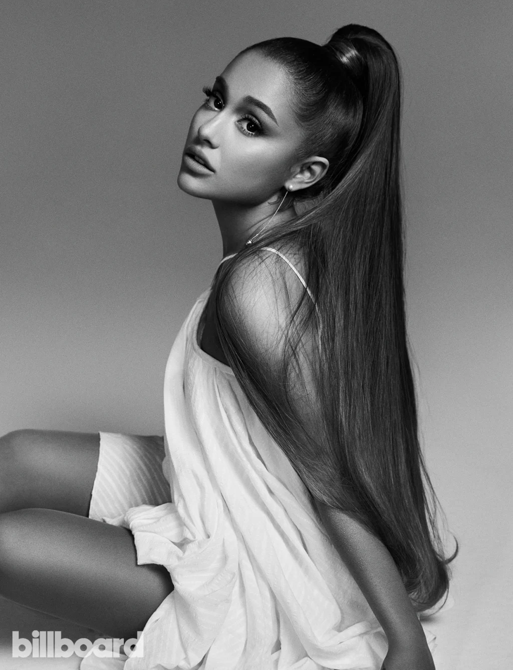 Ariana Grande wearing a white dress "black and white" in a billboard magazine