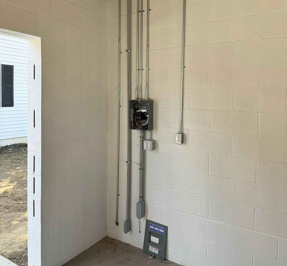 A electrical panel on the wall for a garage automation