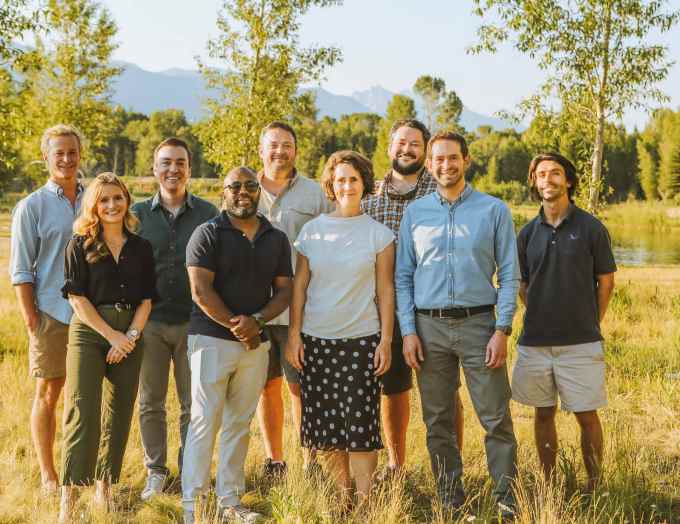 The Blue Bear Capital team stands in a field.