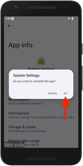 A screenshot of Android in safe mode with an app uninstall dialog box, with a red arrow over the "OK" button