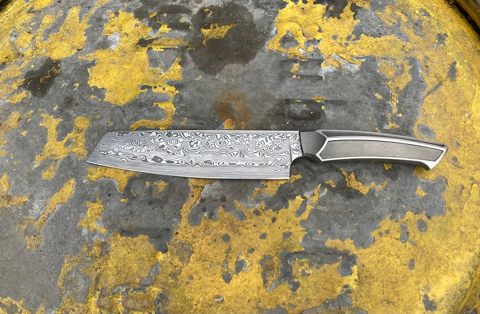 Kochmesser aus Damasteele mit Titangriff