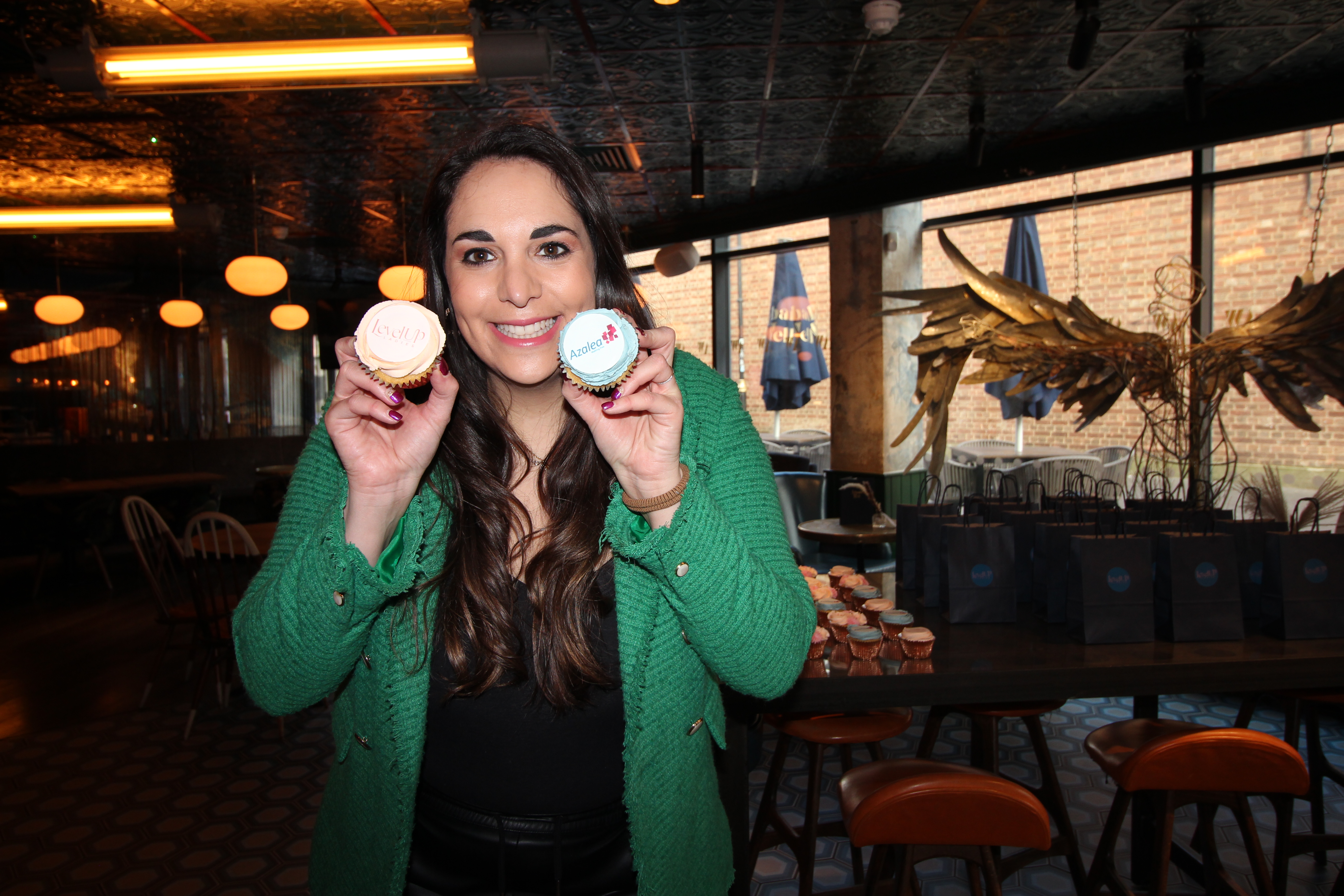 Jess with charity cup cakes at Level Up Ladies fundraising event