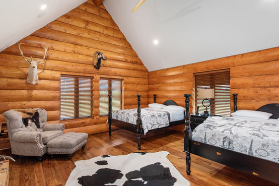 Premium guest room at Triple R Ranch with two queen beds for luxury hunting stays in Whitesboro, Texas