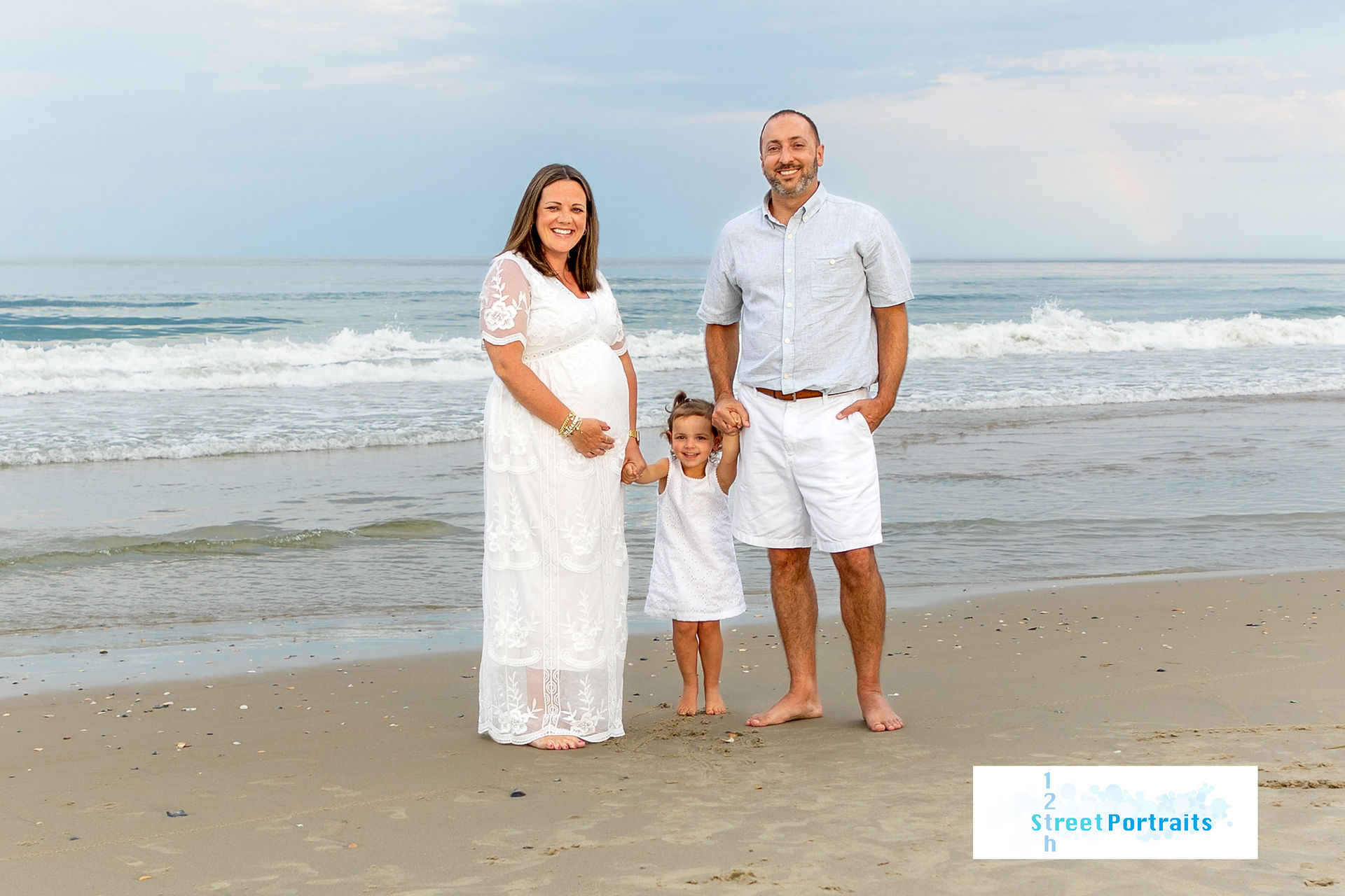 A family of 3 on the beach