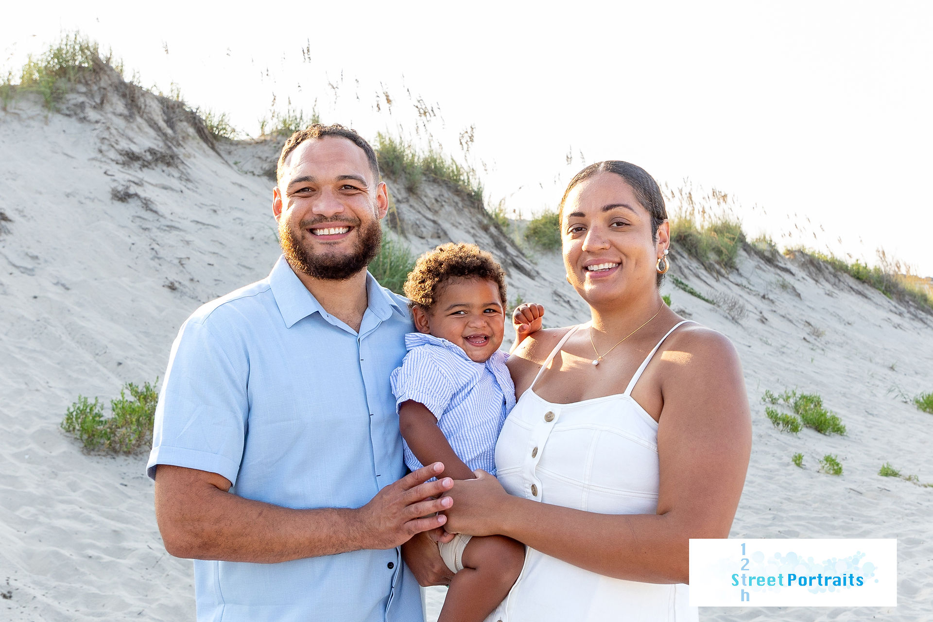 A family of 3 on the beach in Corolla, NC