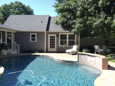 Tranquil poolside retreat with swimming pool and outdoor furniture by FERCO Construction & Remodeling in McKinney, Dallas