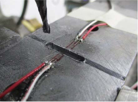 Photograph showing the
Slotting technique having
been carried out on a steel
beam.