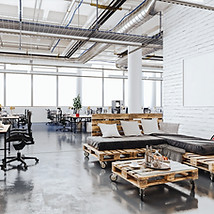 Open-plan office with desks and lounge seating