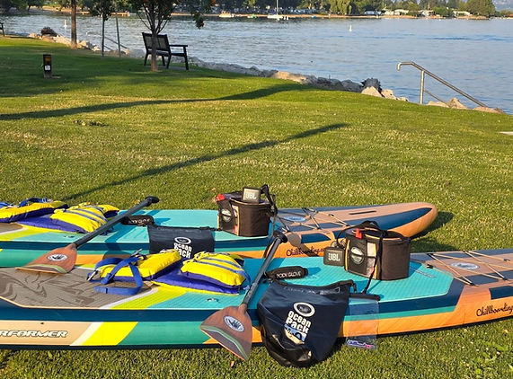 Two paddleboards lakeside, ready for Chill Boarding