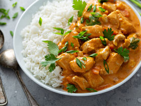 Image of a plate of cashew chicken and steamed rice.