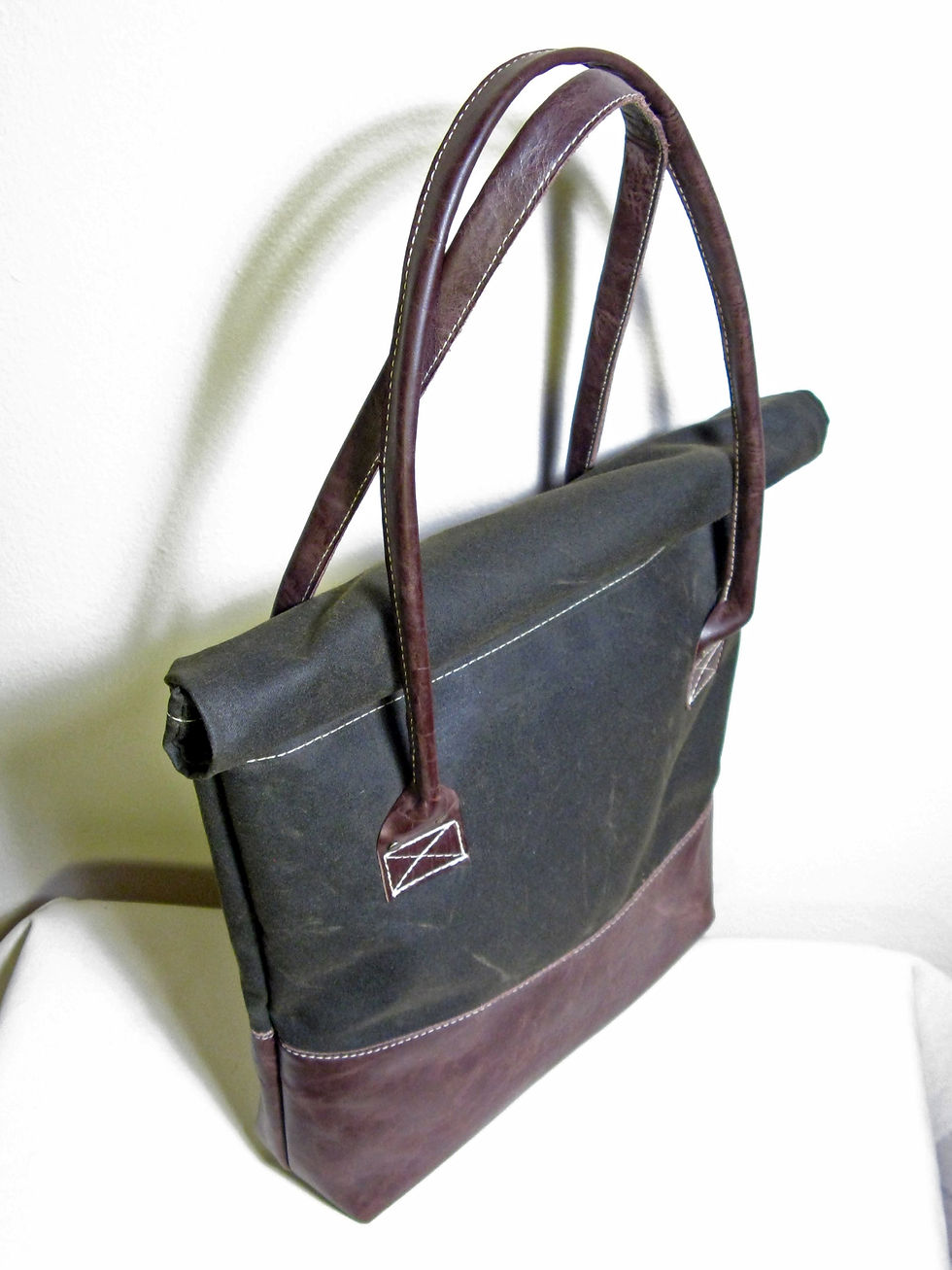 Waxed cotton and leather weather-resistant handbag