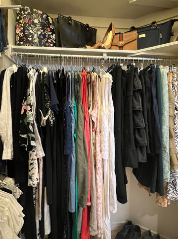 Organized closet with neatly organized clothes, handbags and shoes by Professional organizers in Phoenix, AZ