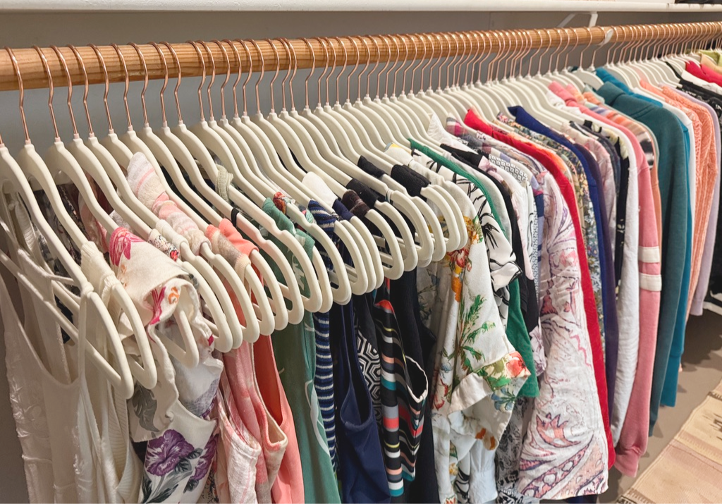 Color-coded clothes arranged in a closet, shown on the company’s Scottsdale page