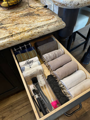 Perfectly organized kitchen drawer with file-folded dishcloths, showcasing a functional and clutter-free design by professional organizers in Arcadia, AZ