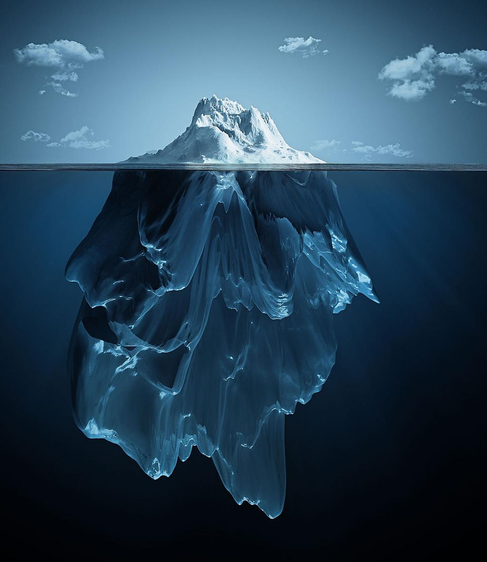 Iceberg with visible underwater section, set against a blue sky with clouds. The image conveys a calm, serene mood.