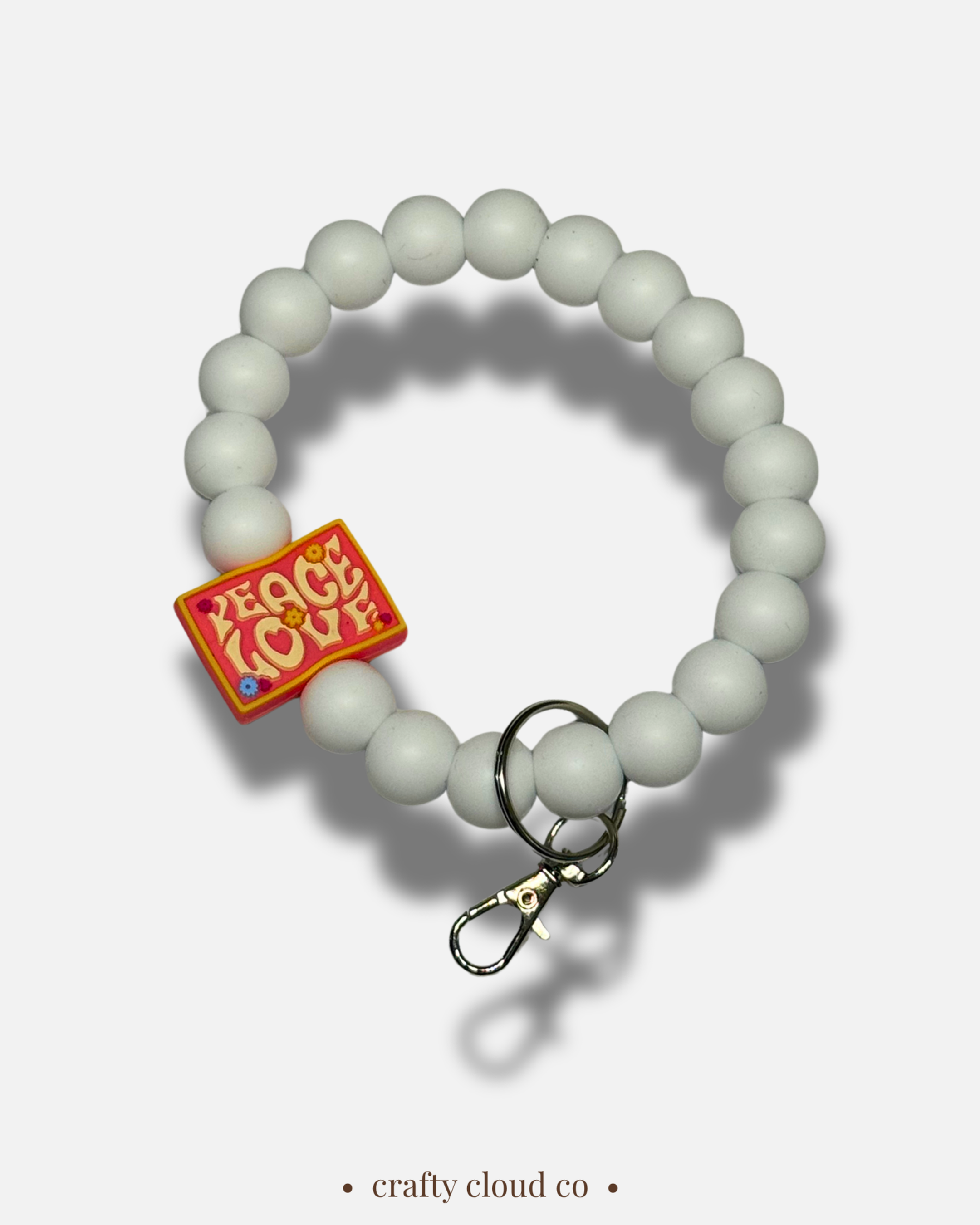 white peace and love wristlet