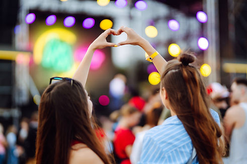 heart-shaped-hands-concert-music-concert-with-lights-silhouette-people-enjoying-concert.jp