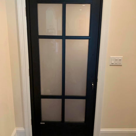 Technician repairing cracked glass in a residential interior door in Gulfport MS