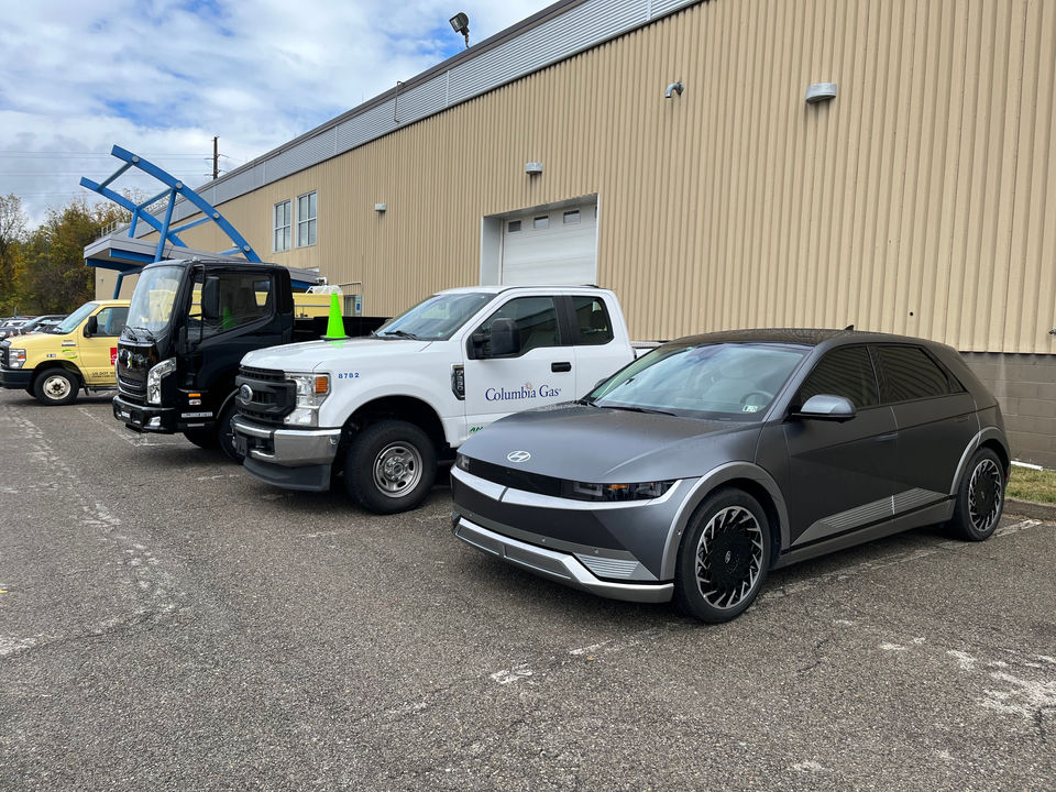 A clean fueled car, truck and electric truck on display outside the automotive high bay at Odyssey Day.