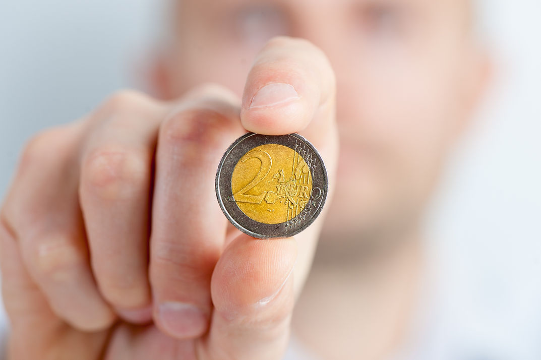 Hand Holding Coin