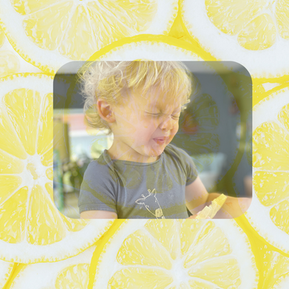 a child sucking a lemon