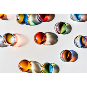 a variety of different colored marbles.