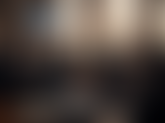 A close-up, professional shot of a modern Indian courtroom setting. A polished wooden desk holds a prominent file labeled "Written Grounds of Arrest" next to law books. A digital screen in the background displays information about constitutional Article 22 rights. The Indian flag is subtly visible, all bathed in warm, editorial-style lighting.