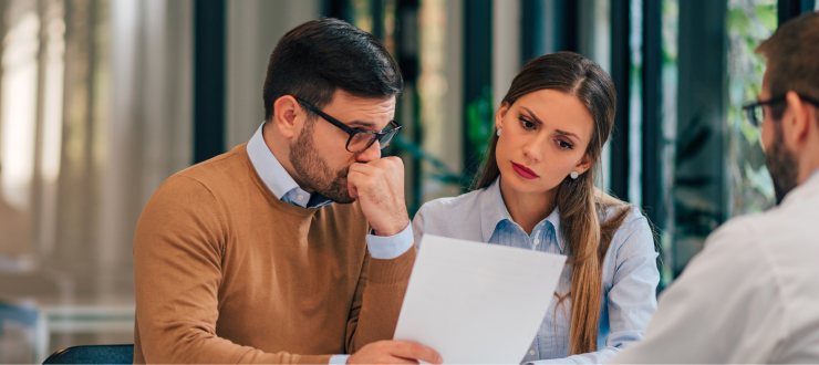 Realtor going over contingencies with couple