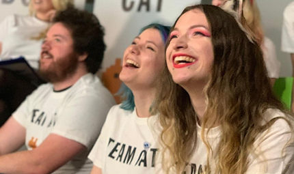 Picture of kayPOWXD at Battersea HQ smiling with controller in hand