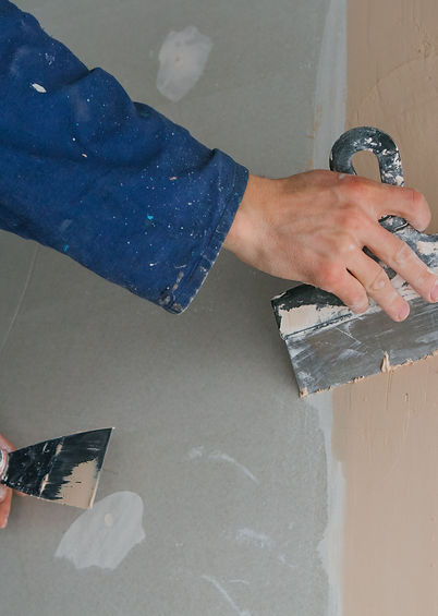man-plastering-two-trowels. Image by freepik, freepic.diller.jpg