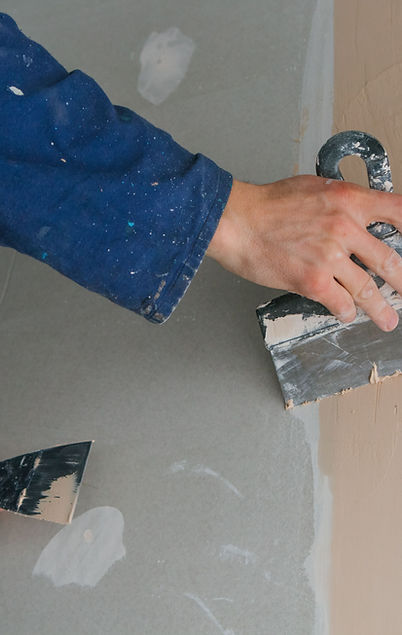 man-plastering-two-trowels. Image by freepik, freepic.diller.jpg