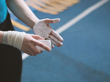 Gymnast Applying Chalk