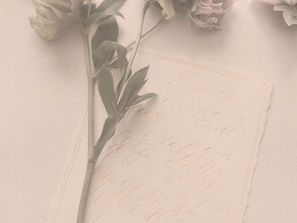 Ohio resident writing a handwritten will while reviewing estate planning documents