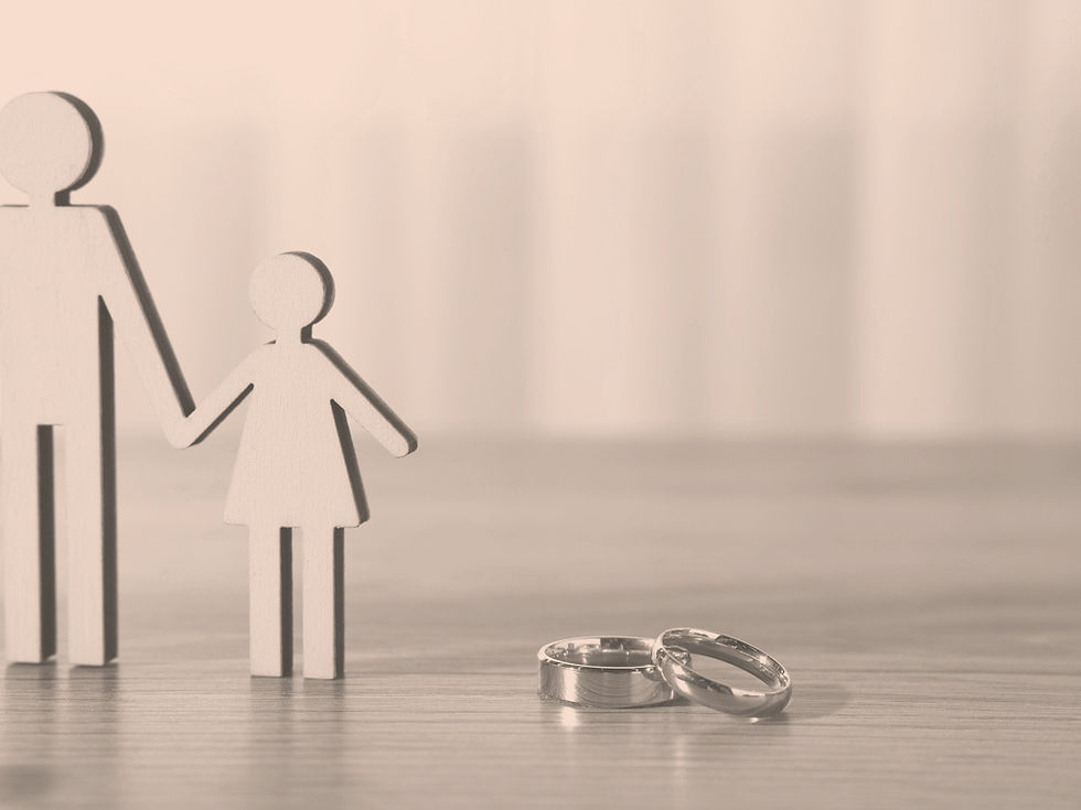 Married couple and child figurines with wedding rings representing trust planning for married couples in Ohio