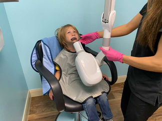 close-up-of-a-child-receiving-xray-treatment-by-nurse.jpg