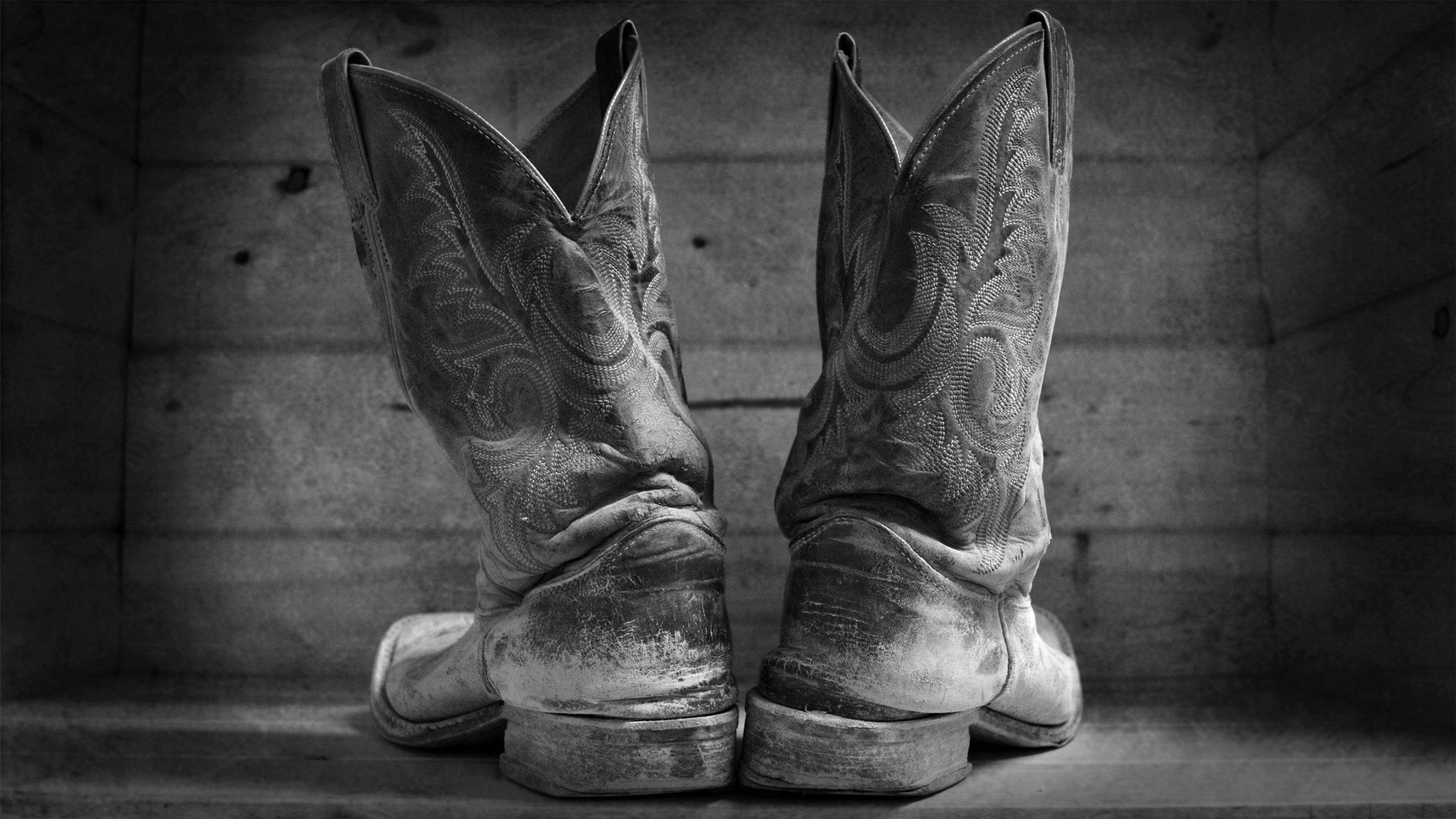 Old Boots is a timeless black-and-white photograph that tells a story without saying a single word. old boots