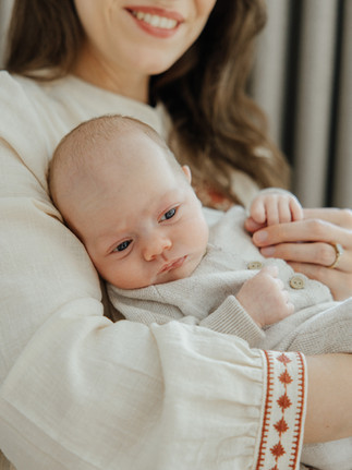 Natural lifestyle portraits of a mother and her firstborn baby in a light and airy home