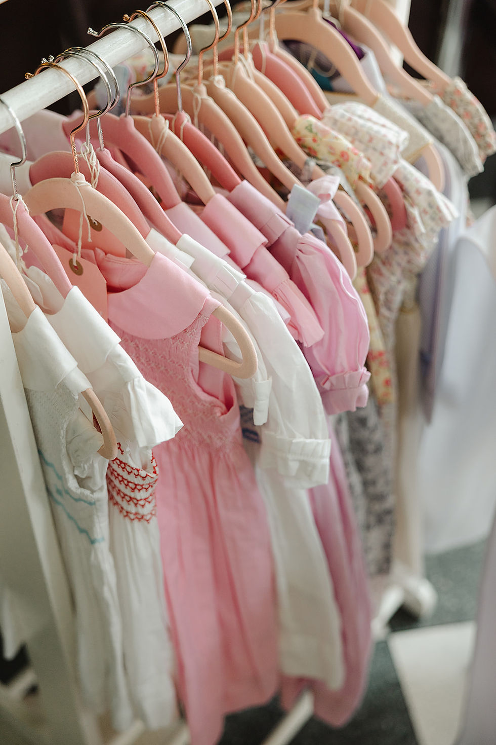 Detail shot of hand-smocked children's dresses by Cute Couture London, photographed by a London family and baby photographer.