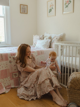 Natural family photography capturing everyday moments with a mother and baby.