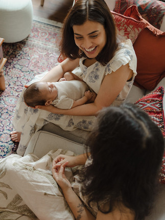 Mother and her sister from India sharing a moment during a baby shoot in Holland Park London.