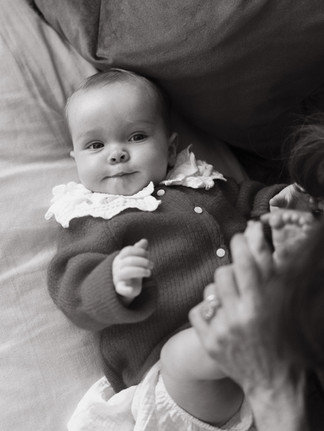 Mother and daughter sharing a cuddle during a baby photography session in Herne Hill.