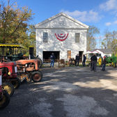 White building with red, white, and blue bunting, outdoor event, Chatham TWP.