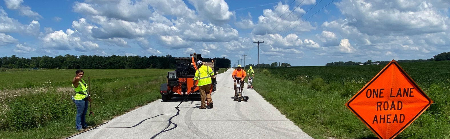 Road construction crew working with