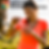 Woman in a bright orange shirt smiles while opening a water bottle outdoors. Bicycle nearby. Logo: Northwest Mental Health Management Services.