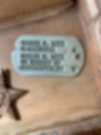 Warren S. Lutz's Dog Tags. Recovered from the wreckage of his B-17, Lutz's dog tags are on display at Homefront to Battlefront: Southampton during WWII (Village Commission on Veterans Patriotic Events Collection)