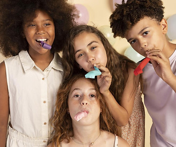 kids-with-party-whistles-medium-shot.jpg