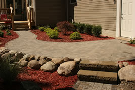 Raised brick patio in Mason, MI by All Terra Landscape Services
