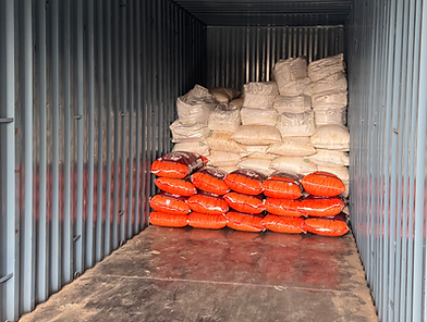 Multi-product shipment of Indian spices in white and red polypropylene bags loaded in a container – Anahat Foods